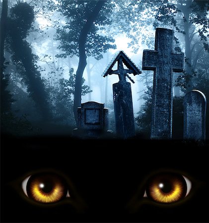 simsearch:400-04214856,k - A look from darkness. Yellow monster eyes and medieval stone crosses and tombstones in a cemetery in a misty forest. Photo toned in blue color Fotografie stock - Microstock e Abbonamento, Codice: 400-09032000