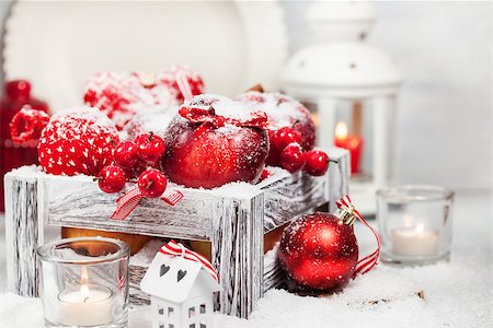Holiday Christmas composition with red apples, balls, cinnamon, snow and candles Stock Photo - Budget Royalty-Free & Subscription, Code: 400-09032010