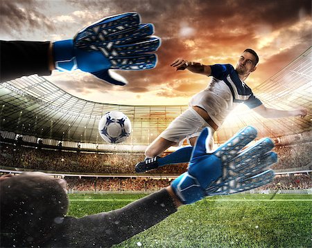 simsearch:400-09083466,k - Goalkeeper catches the ball in the stadium during a football match Foto de stock - Super Valor sin royalties y Suscripción, Código: 400-09032093