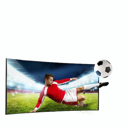 simsearch:400-09032434,k - Soccer player comes out of the tv to kick the ball Stockbilder - Microstock & Abonnement, Bildnummer: 400-09032434