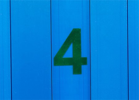the number four green, set against bright blue wood Stockbilder - Microstock & Abonnement, Bildnummer: 400-09045621