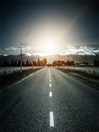 snow road horizon - An image of a road to the alps with dramatic sun light Foto de stock - Super Valor sin royalties y Suscripción, Código: 400-09045708