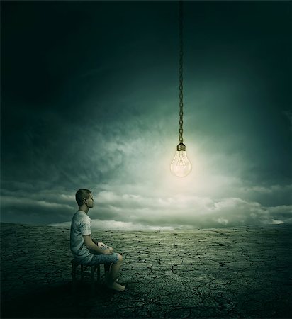 simsearch:400-07976631,k - Creative idea concept with a man sitting on a chair in the middle of a desert, looking at a lightbulb Foto de stock - Royalty-Free Super Valor e Assinatura, Número: 400-09045763
