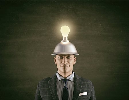 Conceptual image of a businessman and a light bulb overhead.This is a 3d render illustration. Stock Photo - Budget Royalty-Free & Subscription, Code: 400-09064088