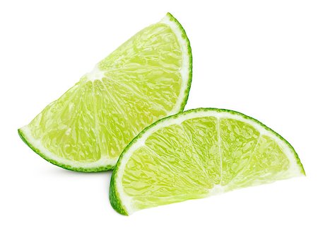 simsearch:400-08967896,k - Two ripe slices of green lime citrus fruit isolated on white background with clipping path Photographie de stock - Aubaine LD & Abonnement, Code: 400-09064214