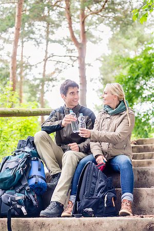 drinker walking - Backpackers hiking and taking rest in the woods and having mineral water Stock Photo - Budget Royalty-Free & Subscription, Code: 400-09064332