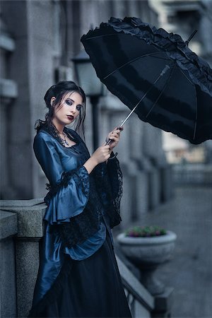 Woman dressed in blue victorian dress stand near old building Stock Photo - Budget Royalty-Free & Subscription, Code: 400-09065151