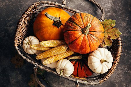 Pumpkins and corn in the basket, top view. Autumn background Fotografie stock - Microstock e Abbonamento, Codice: 400-09066485