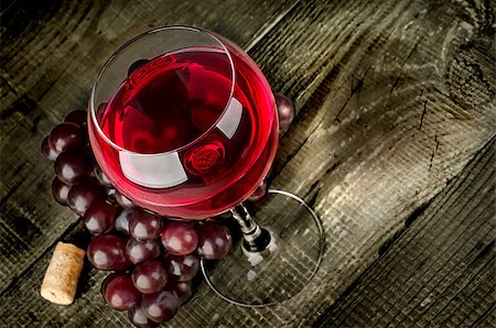 simsearch:400-07316439,k - Glass of red wine with grapes on a wooden table Stock Photo - Budget Royalty-Free & Subscription, Code: 400-09066974