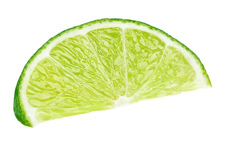 simsearch:400-08967896,k - Ripe slice of green lime citrus fruit lying isolated on white background with clipping path Photographie de stock - Aubaine LD & Abonnement, Code: 400-09067447