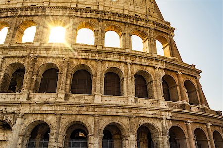 Colosseum closeup view, the world known landmark of Rome. Also known as the Flavian Amphitheatre is an oval amphitheatre in the centre of the city of Rome, Italy. Stock Photo - Budget Royalty-Free & Subscription, Code: 400-09067831