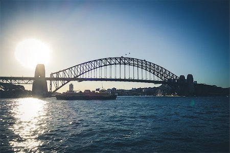 Sydney Harbour Bridge and boat at sunset, Australia Stock Photo - Budget Royalty-Free & Subscription, Code: 400-09068737