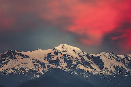 simsearch:400-05117107,k - Beautiful sunset over the snowy mountain peak. Nature landscape scene. Dramatic overcast red sky. Holidays, travel, sport, recreation. Main Caucasian ridge, Svaneti, Georgia. Retro toning filter Stock Photo - Budget Royalty-Free & Subscription, Code: 400-09069605