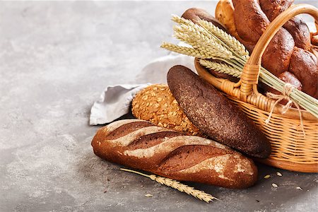 simsearch:400-06416084,k - Different fresh bread in the basket on a grey background with copy space. Photographie de stock - Aubaine LD & Abonnement, Code: 400-09069629