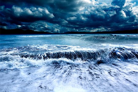 Stormy seascape .Ocean storm.Waves and dark cloudy sky Stock Photo - Budget Royalty-Free & Subscription, Code: 400-09062700