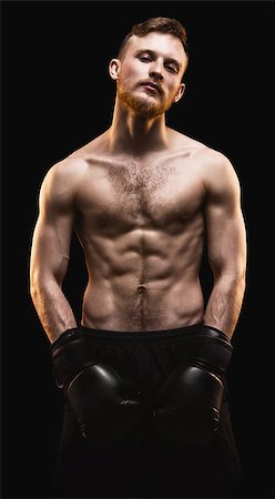 simsearch:400-04922500,k - Bearded athlete with boxing gloves on black background Photographie de stock - Aubaine LD & Abonnement, Code: 400-09062868