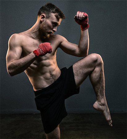 simsearch:400-04922500,k - Bearded fighter during hard workout on black background Photographie de stock - Aubaine LD & Abonnement, Code: 400-09062869