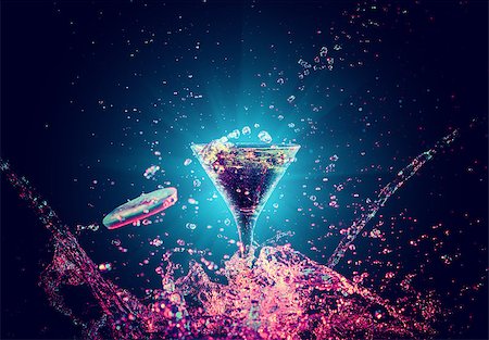 simsearch:400-06409646,k - Colourful cocktail in glass with splash on the dark background Stock Photo - Budget Royalty-Free & Subscription, Code: 400-09062954