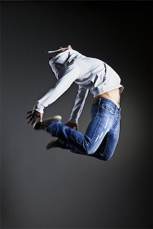 Cool looking dancer posing in front of the studio background Fotografie stock - Microstock e Abbonamento, Codice: 400-09062958