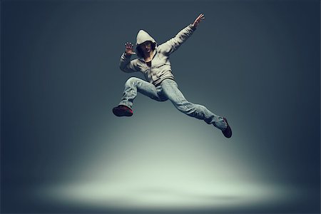 simsearch:400-07481076,k - Hip hop dancer jumping and performing some of his dance. This is a 3d render illustration Photographie de stock - Aubaine LD & Abonnement, Code: 400-09063187