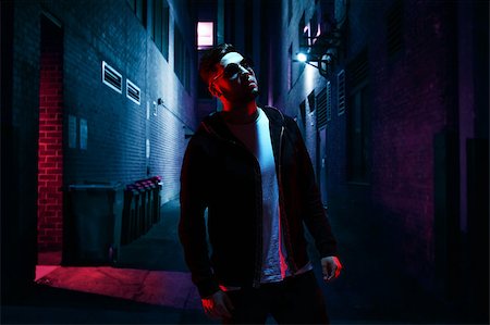 simsearch:695-05777077,k - Cool man in sunglasses standing on empty alley at night. Stock Photo - Budget Royalty-Free & Subscription, Code: 400-09063761