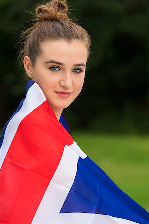 Pretty teenage girl female young woman outside in summer wrapped in a British Union Jack flag at a party, music fesitival or concert Stock Photo - Budget Royalty-Free & Subscription, Code: 400-09063780