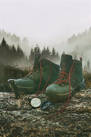 Hiking boots with knife and compass on tree log with mountains Stock Photo - Budget Royalty-Free & Subscription, Code: 400-09063922