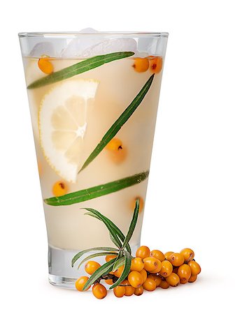 Lemonade from sea buckthorn isolated on white background. Leaves and berries of sea buckthorn in a misted glass with ice. Stock Photo - Budget Royalty-Free & Subscription, Code: 400-09070941