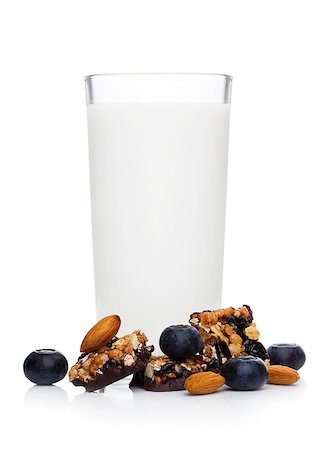simsearch:400-09238081,k - Cereal bar bits blueberries and glass of milk on white background Photographie de stock - Aubaine LD & Abonnement, Code: 400-09084298