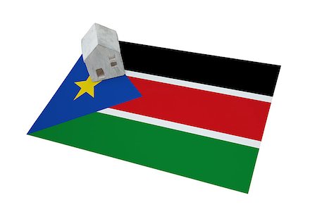 profugo (uomo e donna) - Small house on a flag - Living or migrating to South Sudan Fotografie stock - Microstock e Abbonamento, Codice: 400-09084954