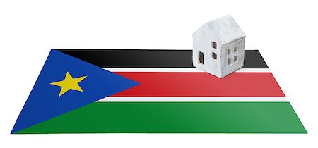 profugo (uomo e donna) - Small house on a flag - Living or migrating to South Sudan Fotografie stock - Microstock e Abbonamento, Codice: 400-09084950