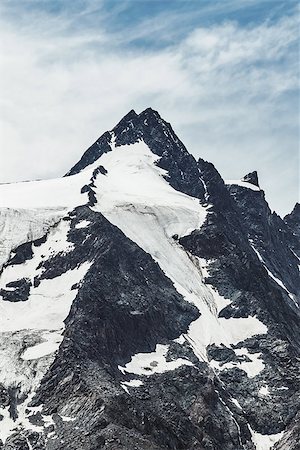 sleet - Snowbound summit of Alps mountains. Grossglockner, Austria. Blue sky with clouds. Stock Photo - Budget Royalty-Free & Subscription, Code: 400-09080246