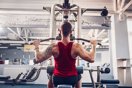 simsearch:400-05180877,k - Strong Bearded Bodybuilder Doing Heavy Weight Exercise For Back On Machine. Stock Photo - Budget Royalty-Free & Subscription, Code: 400-09080290