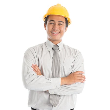 engineer background - Portrait of attractive Southeast Asian engineer with yellow hard hat arms crossed smiling, standing isolated on white background. Stock Photo - Budget Royalty-Free & Subscription, Code: 400-09080833