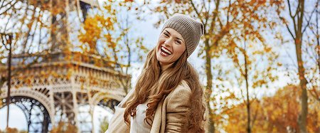 simsearch:400-09031587,k - Autumn getaways in Paris. Portrait of happy young woman near Eiffel tower having fun time Stock Photo - Budget Royalty-Free & Subscription, Code: 400-09080952