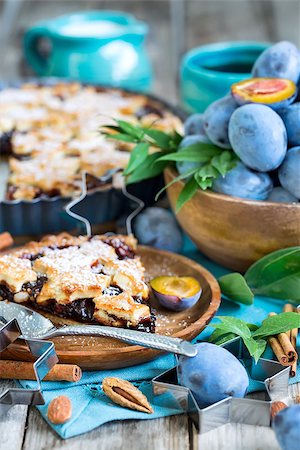 Homemade traditional plum pie with cinamon and almonds with coffee on old wooden background Stock Photo - Budget Royalty-Free & Subscription, Code: 400-09081293