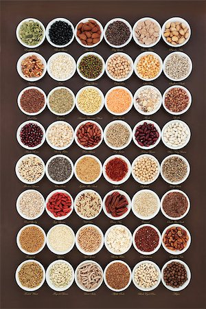 simsearch:400-08429907,k - High fiber health food sampler with cereals, nuts, seeds, grain, fruit, herbs and legumes with foods high in omega 3 fatty acid, antioxidants and vitamins, top view. With titles. Fotografie stock - Microstock e Abbonamento, Codice: 400-09081597