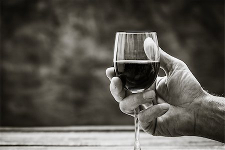 Senior wine expert tasting a glass of red wine in the cellar, hand close up, wine tradition and culture concept Stock Photo - Budget Royalty-Free & Subscription, Code: 400-09082194