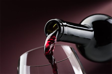 simsearch:400-04279337,k - Pouring red wine from a bottle into a wineglass: wine tasting and celebration Foto de stock - Super Valor sin royalties y Suscripción, Código: 400-09082199