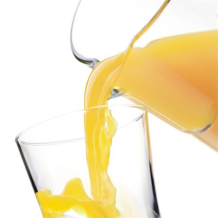 simsearch:400-09082204,k - Pouring refreshing orange or pineapple yellow juice in a glass, healthy drinks concept Foto de stock - Royalty-Free Super Valor e Assinatura, Número: 400-09082208