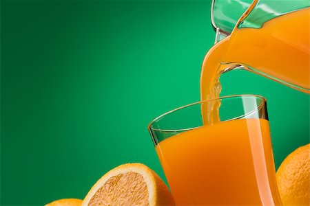 simsearch:400-09082204,k - Pouring orange juice into a glass and sliced fresh oranges, vitamins and healthy drinks concept Stock Photo - Budget Royalty-Free & Subscription, Code: 400-09082201