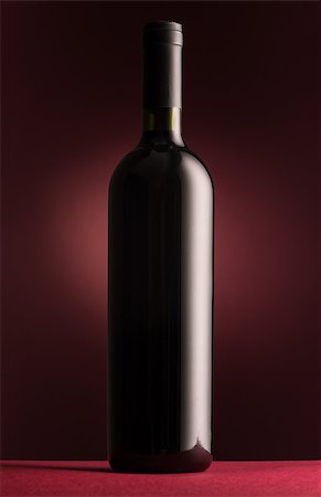 simsearch:400-09222970,k - Excellent unlabeled red wine bottle on red background Stock Photo - Budget Royalty-Free & Subscription, Code: 400-09082234
