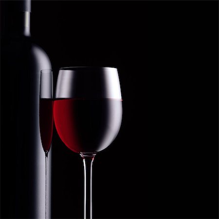 simsearch:400-09222970,k - Excellent red wine tasting and celebration: wine bottle and full wineglass on black background Stock Photo - Budget Royalty-Free & Subscription, Code: 400-09082236