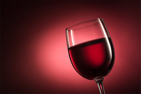 simsearch:400-09222970,k - Red wine in a wineglass on red background, wine tasting, luxury and celebration concept Stock Photo - Budget Royalty-Free & Subscription, Code: 400-09082238