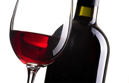 simsearch:400-04279337,k - Excellent red wine tasting: wine bottle and wineglass on white background, close up Foto de stock - Super Valor sin royalties y Suscripción, Código: 400-09082240