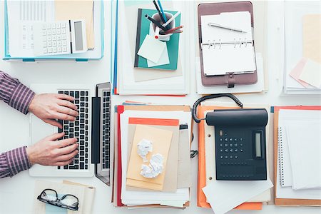 simsearch:400-08613671,k - Businessman working at his full office desk and typing with a laptop, business and technology concept Stock Photo - Budget Royalty-Free & Subscription, Code: 400-09082274