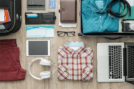 simsearch:400-09222181,k - Getting ready for a trip and packing a suitcase before leaving; accessories, clothing and personal items on a desktop, travel and vacations concept Fotografie stock - Microstock e Abbonamento, Codice: 400-09082289