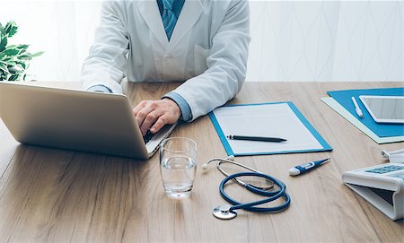 simsearch:400-08751444,k - Professional doctor working in his office and typing with a laptop, healthcare and medicine concept Photographie de stock - Aubaine LD & Abonnement, Code: 400-09082306