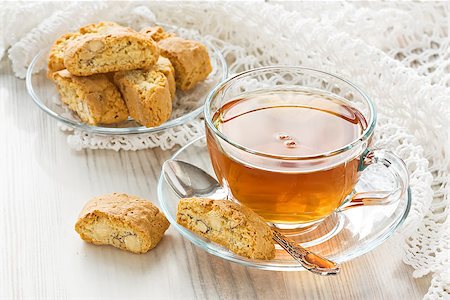 Transparent cup herbal tea with homemade cantuccini cookies Fotografie stock - Microstock e Abbonamento, Codice: 400-09082675