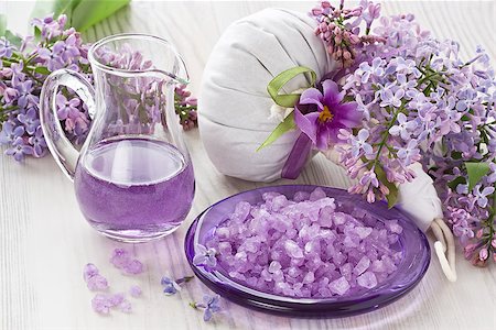Aroma oil, sea salt, herbal massage bag and lilac flower on wooden background Fotografie stock - Microstock e Abbonamento, Codice: 400-09082678